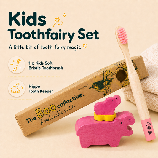 Kids Toothfairy Set by The Boo Collective, featuring a wooden horse-shaped toothbrush with pink bristles, a pink hippo-shaped tooth holder, and a bamboo toothbrush case with a bird illustration, displayed on a beige background with text overlays.