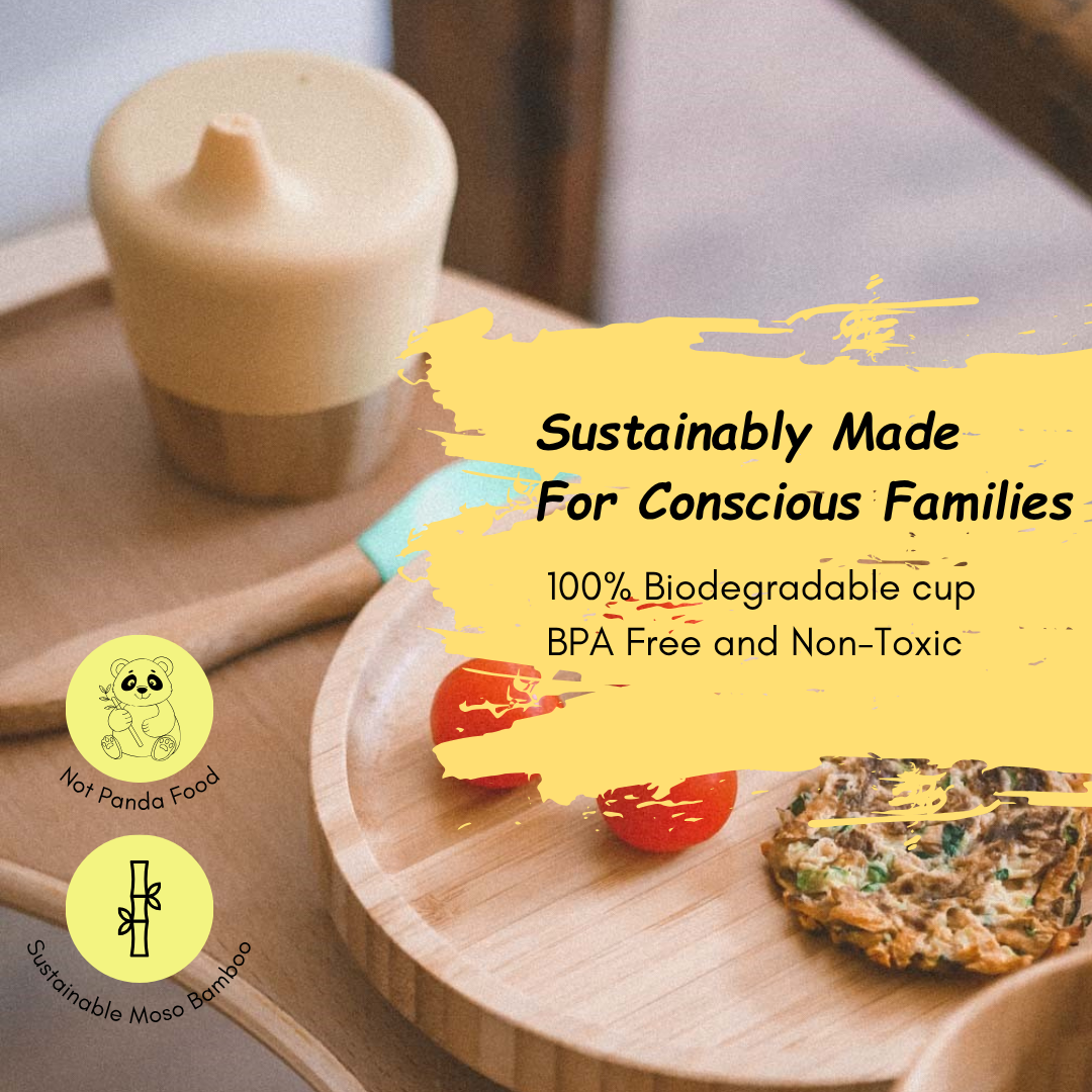 Biodegradable cup on a wooden plate with food, featuring sustainability text and icons.