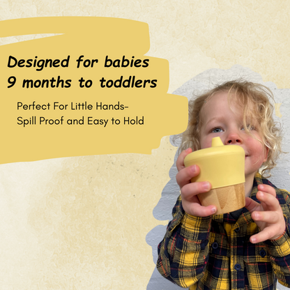 Child holding a yellow cup with text about its design for babies 9 months to toddlers.