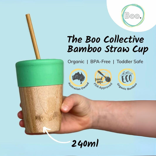 Bamboo straw cup with mint blue lid held by a hand, against a light blue background with 'Boo' branding.