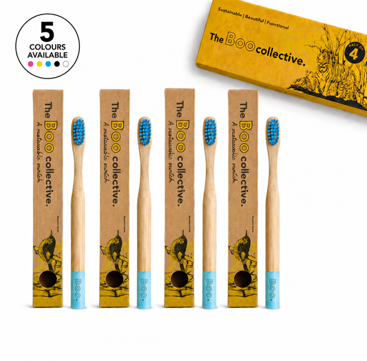 Set of bamboo toothbrushes with blue bristles and packaging from The Boo collective on a white background.
