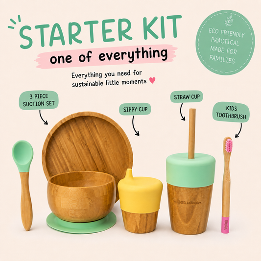 A children's starter kit with wooden and silicone baby items on a light beige background. The set includes a wooden bowl with a mint green silicone base and spoon, a yellow sippy cup, a wooden cup with a mint green lid and straw, and a kids toothbrush with a pink handle.