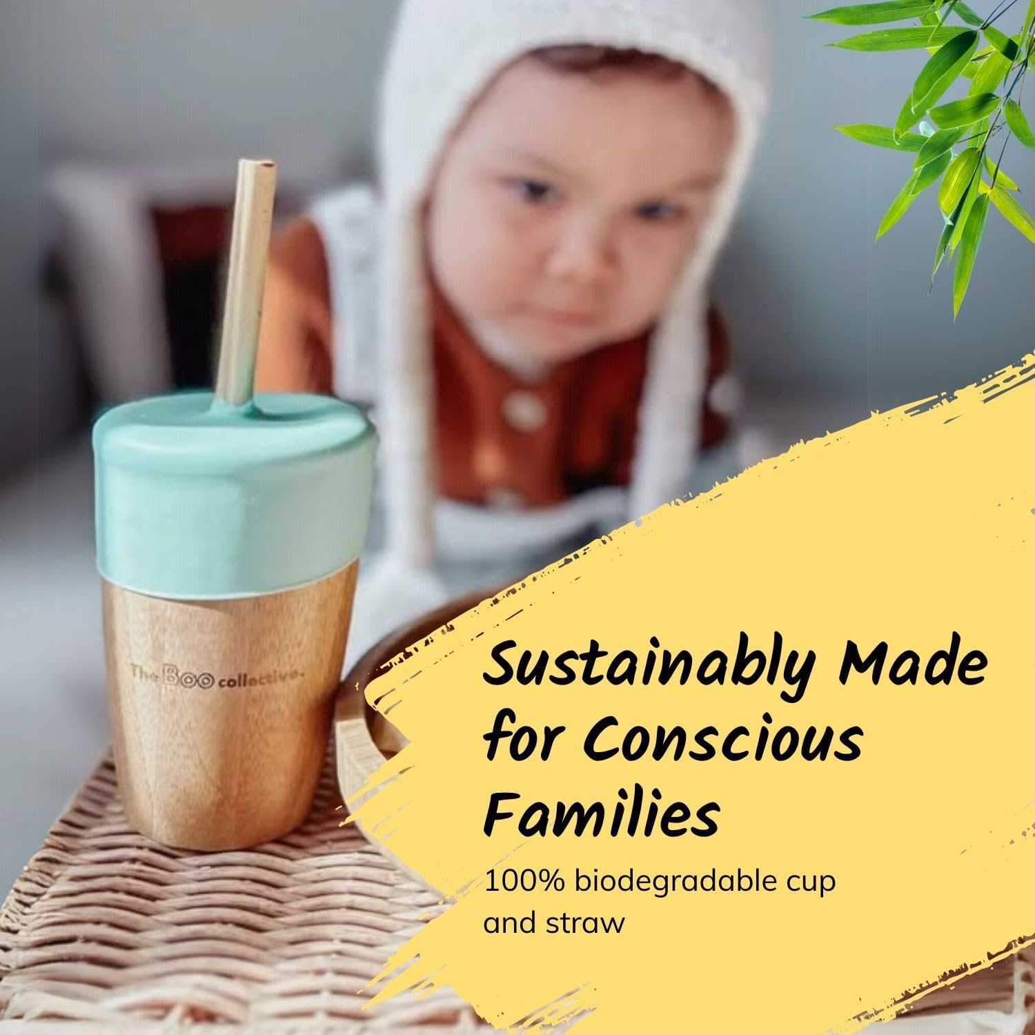 Biodegradable cup and straw with a child in the background and text about sustainability.